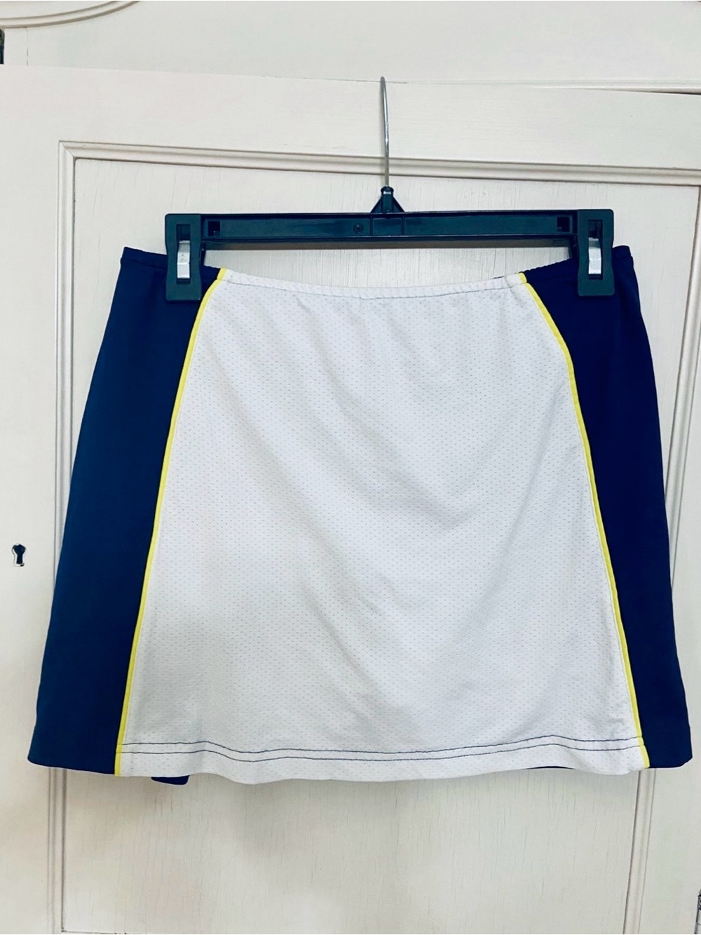 LBH Athletic skort Navy with a White front Panel and yellow pin strip size Large